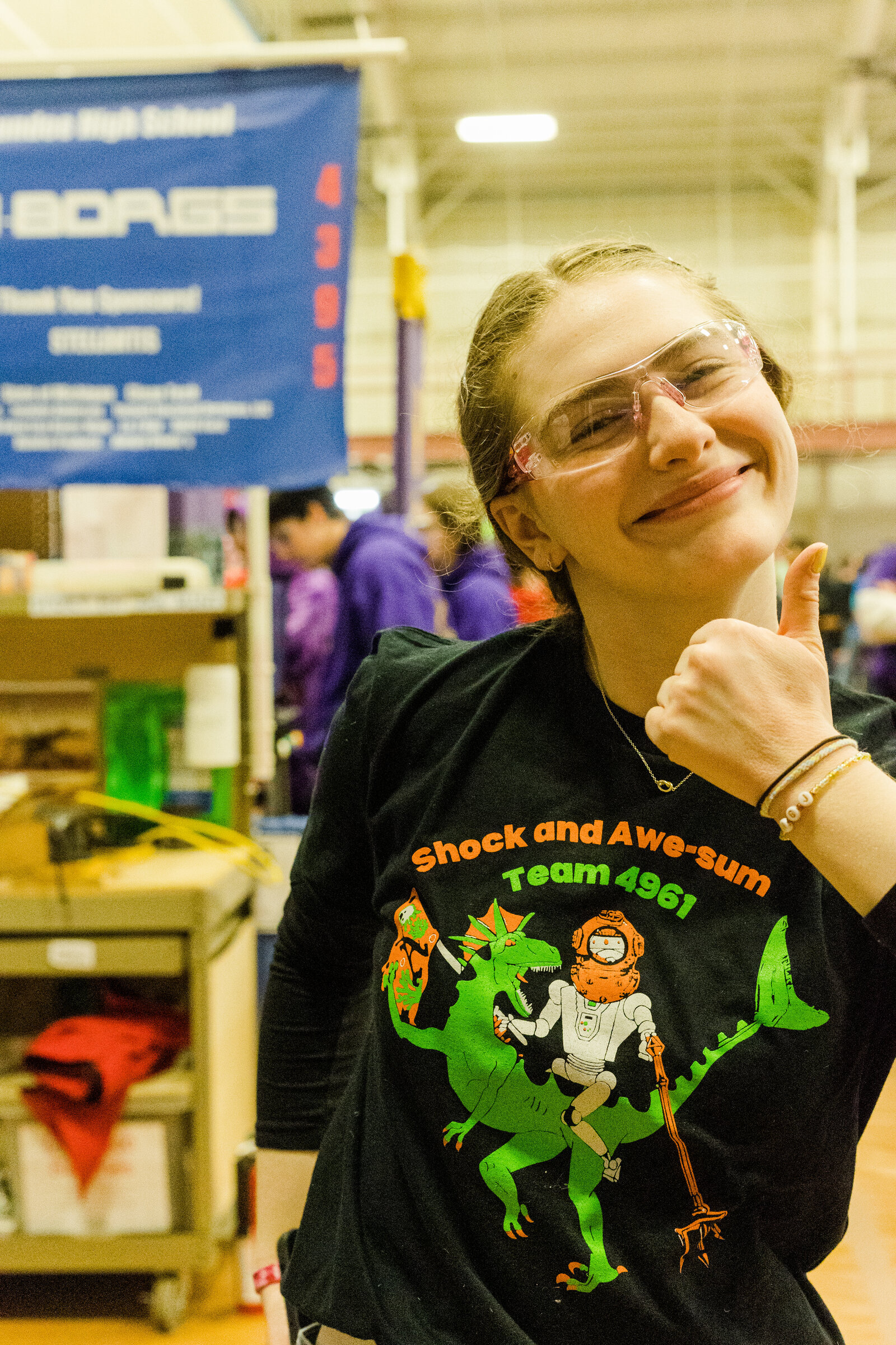 Student in the pits giving thumbs up